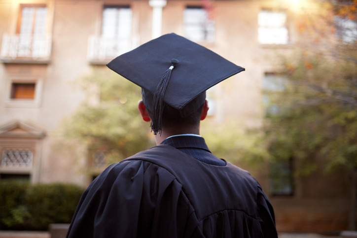 Rear view of a graduate wearing a cap and gown