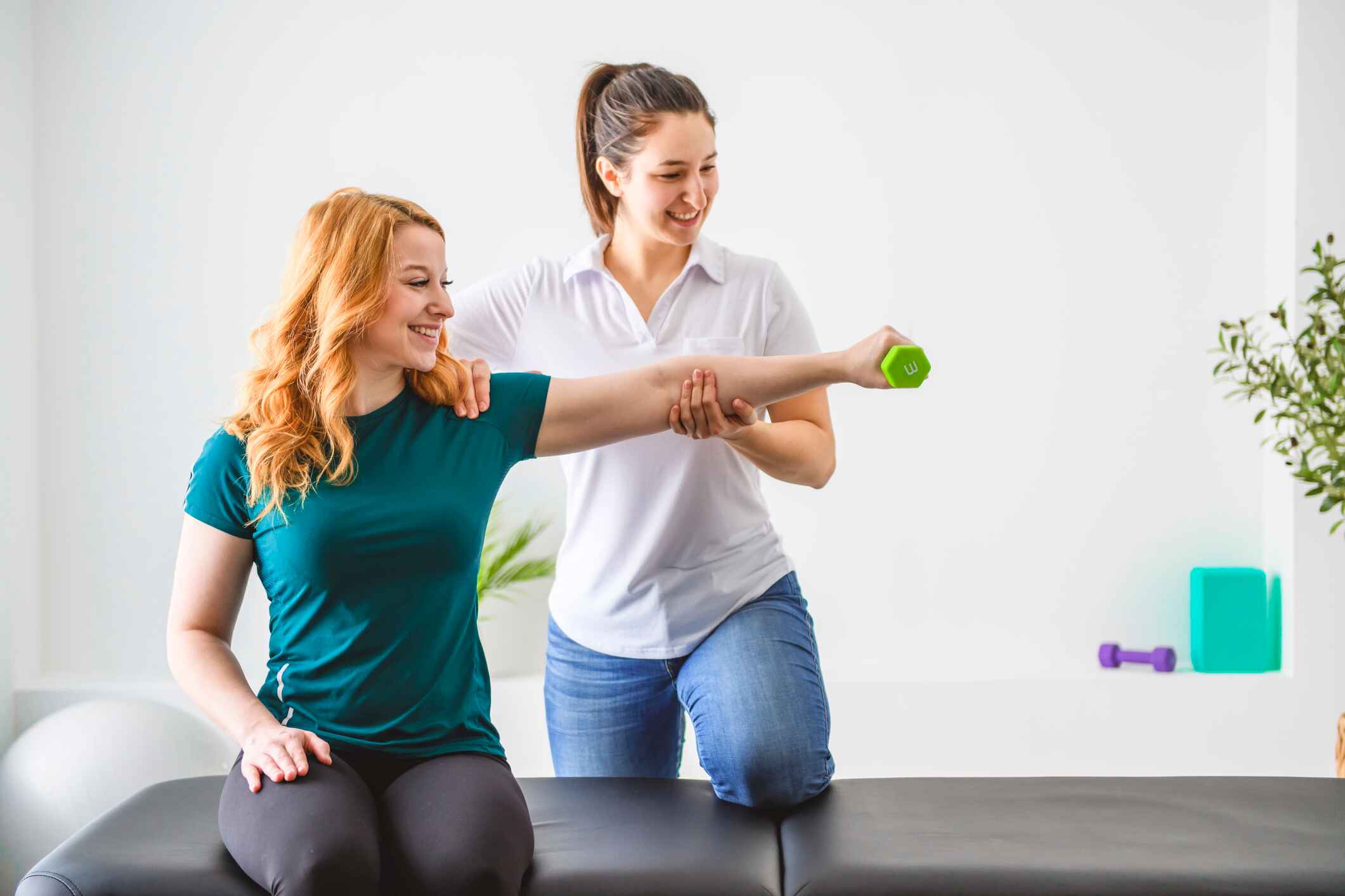 physical therapist helping a patient with exercises